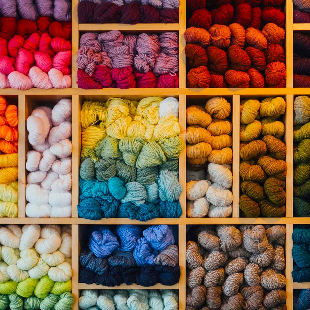 Cabinet of organized different colored yarns