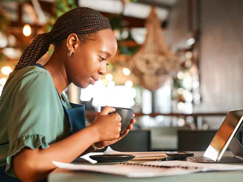 Female shop owner reviewing her bookkeeping